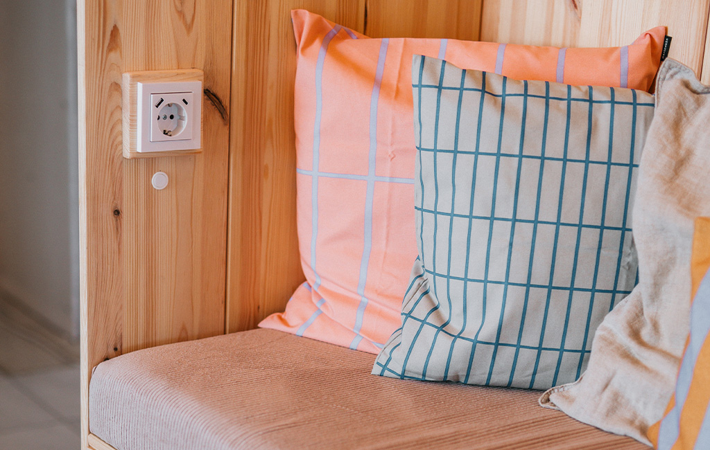 Close-up of a socket with a wooden frame inside the beach chair.