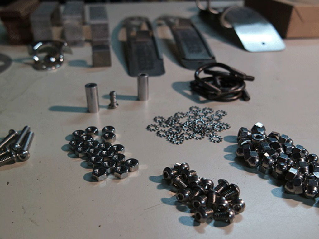 Numerous small parts and screws required to assemble the smoker.