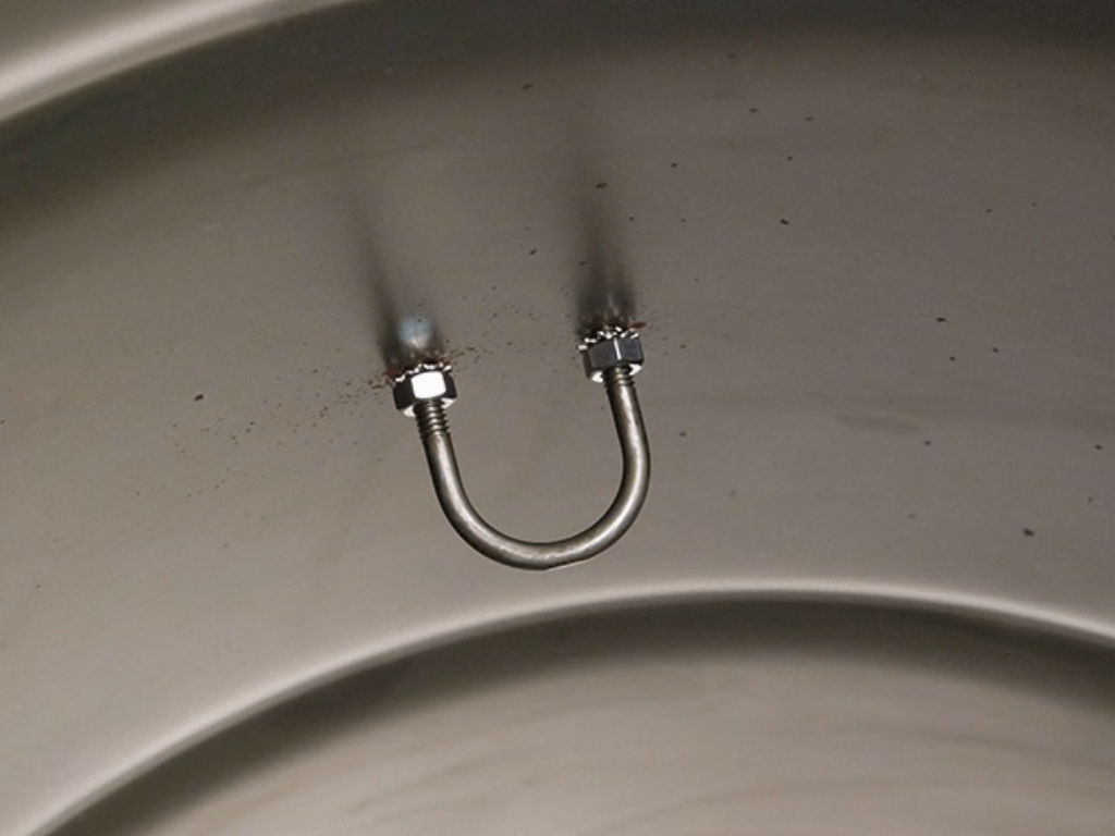 A curved U-bracket is attached