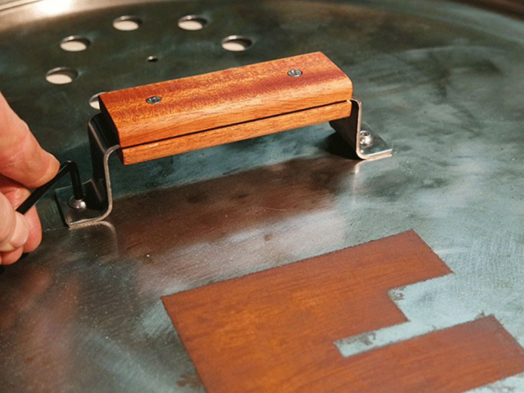 Handle is attached to the BBQ smoker