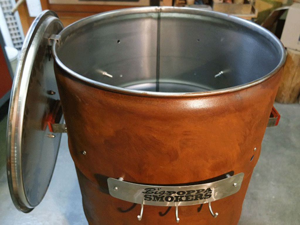 the barrel for the smoker with open lid