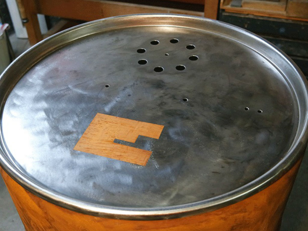 The barrel for the smoker with an Einhell logo.