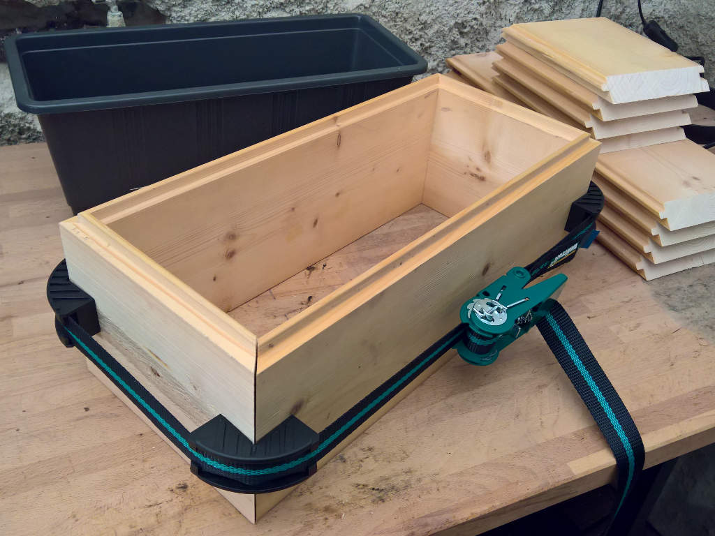 wooden box is clamped