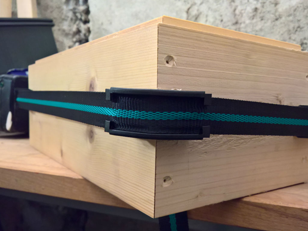 Wood is held together with a tensioning strap