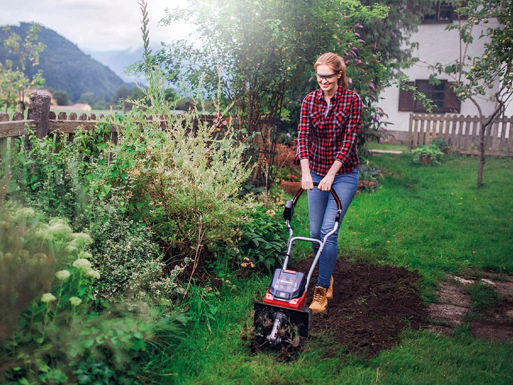 a garden is hoed with a soil hoe