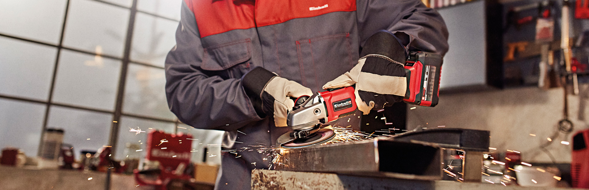 a man cuts with an angle grinder and sparks fly