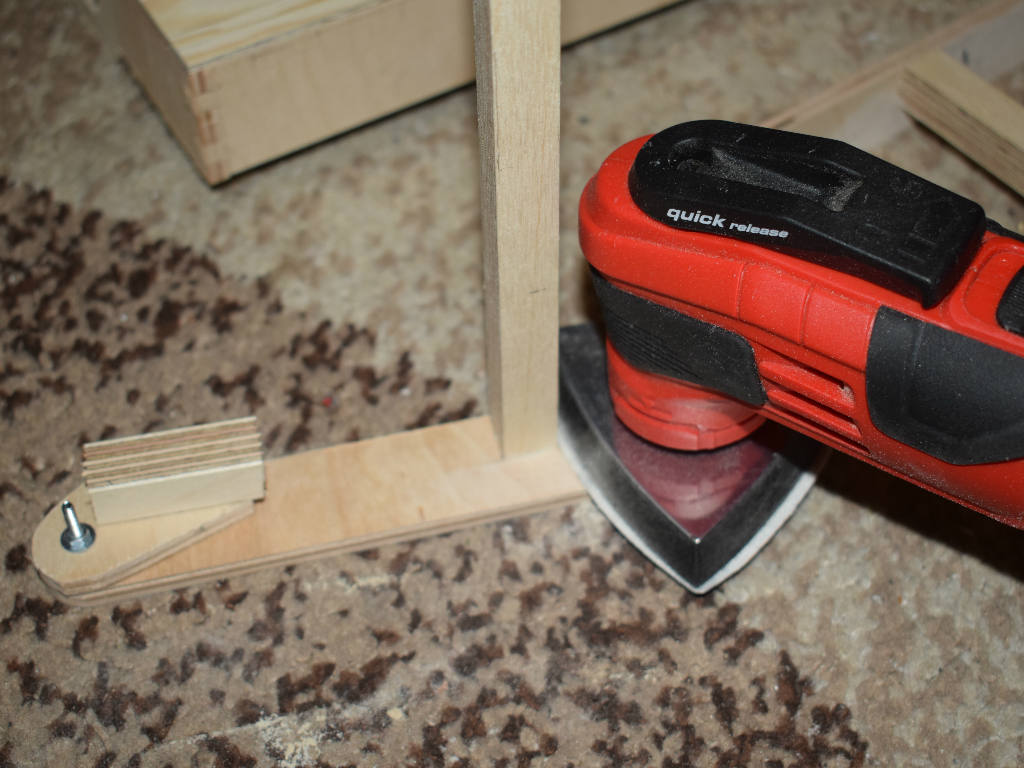 wood is sanded with triangular sander