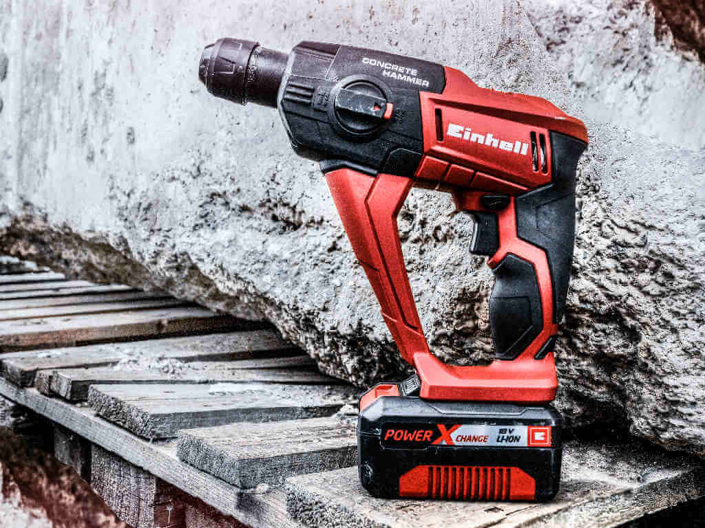 drill in front of a stone