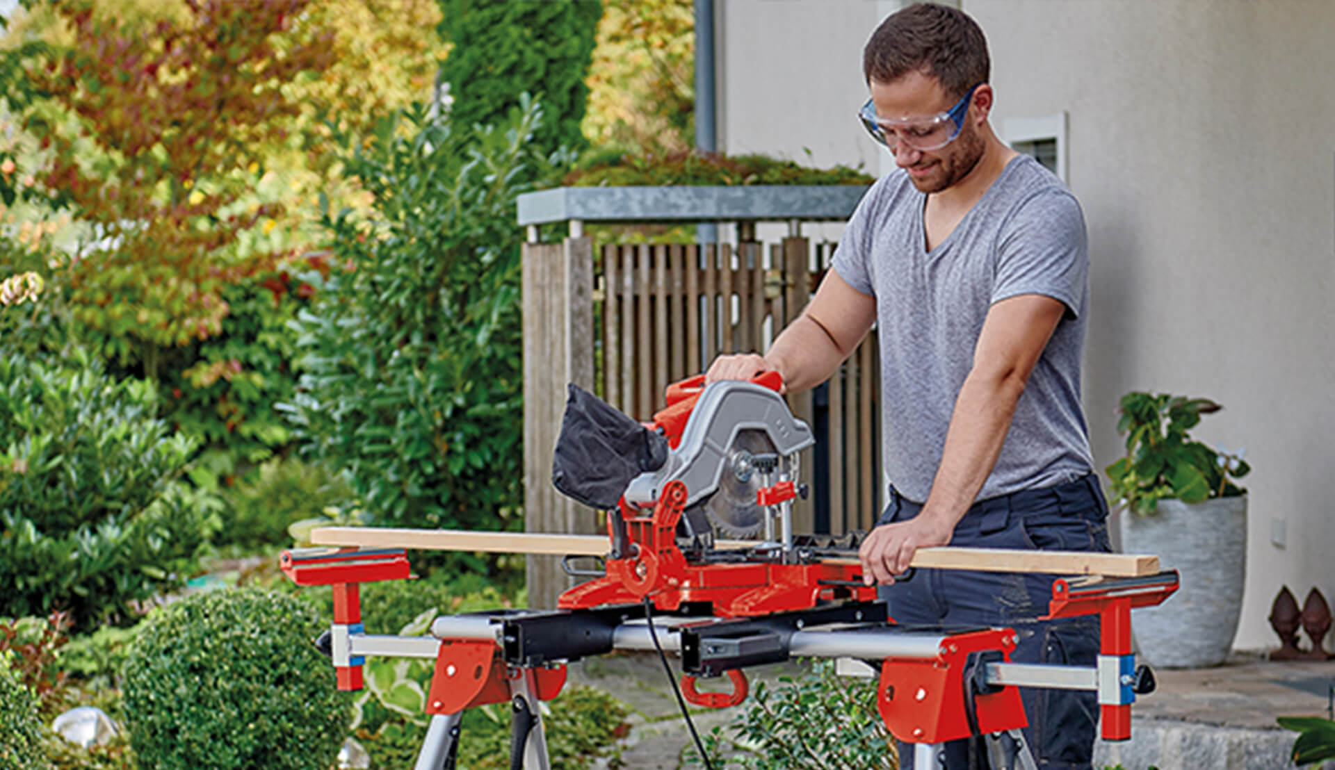 man using Einhell mitre saw