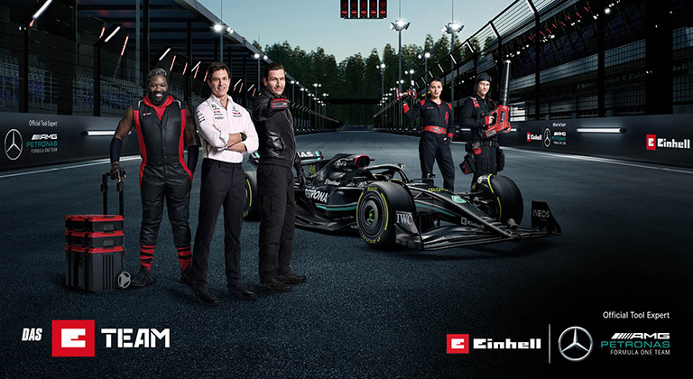 E team members alongside the Formula 1 team