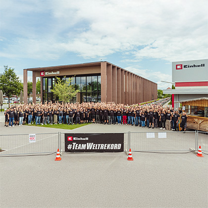 The Guinness World Records logo over an event photo showing Einhell tools.