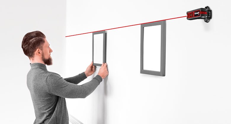 man working with a measuring tool