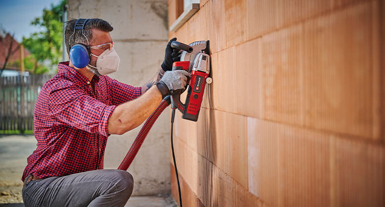 man using a wall liner