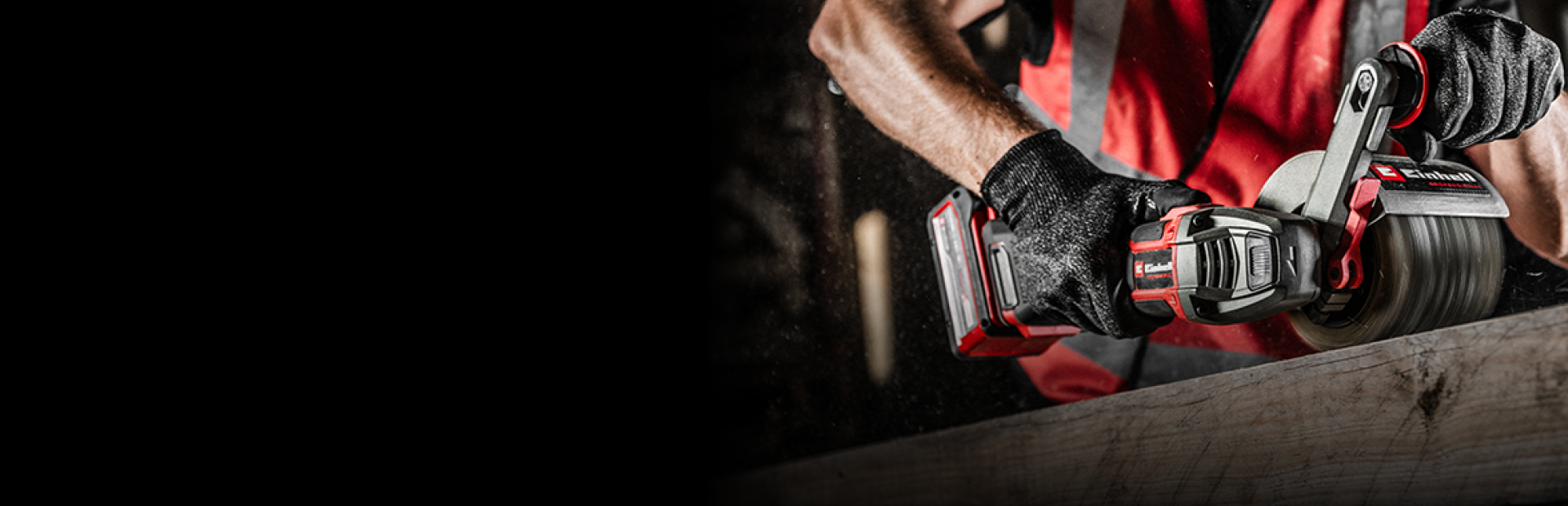 The image shows a person using a red and black Einhell power tool to sand a wooden surface.