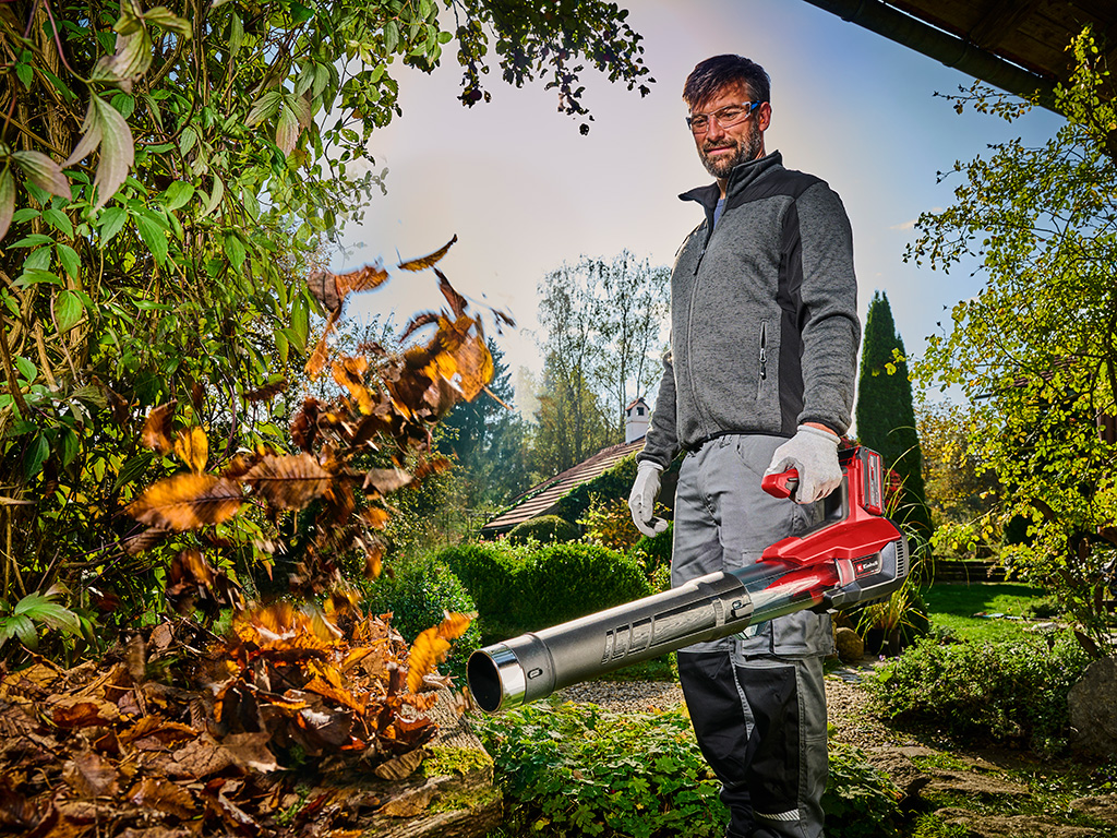 A man using the leaf blower